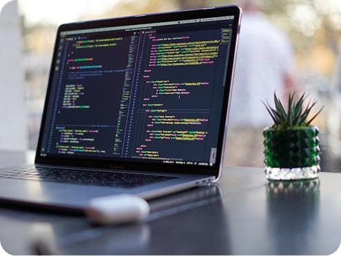 Student learning to code on a laptop